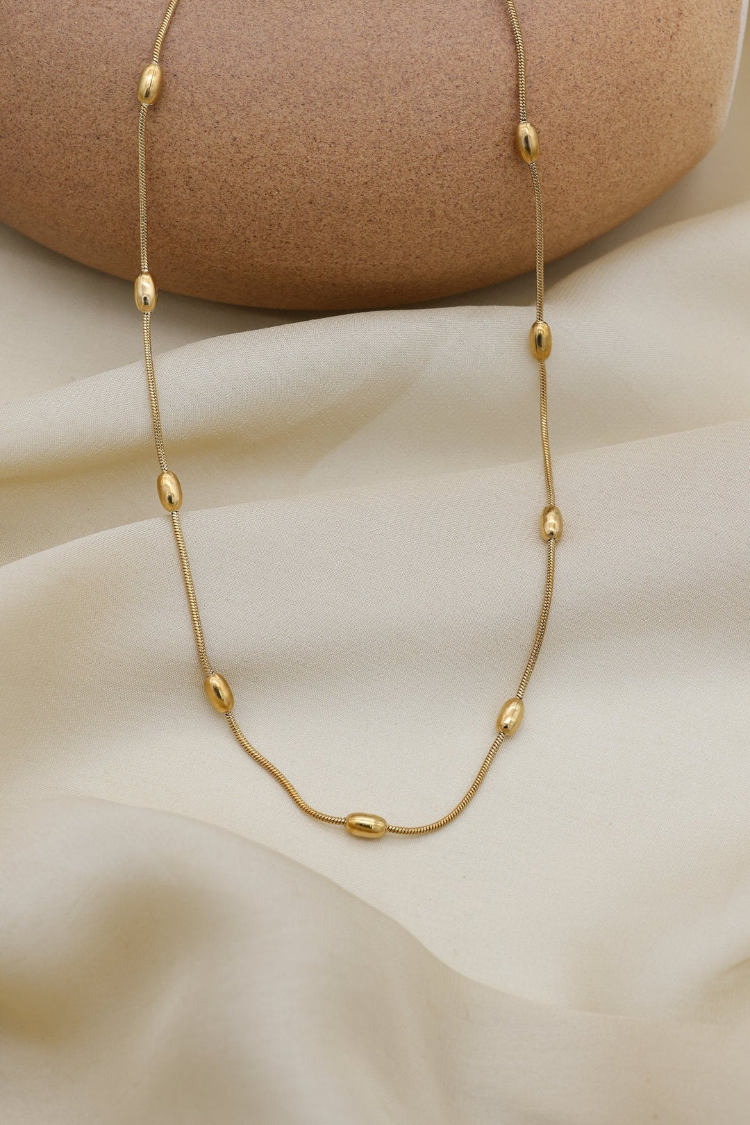 Oval Bead Necklace by FSL&CO, elongated oval gold beads on a snake chain