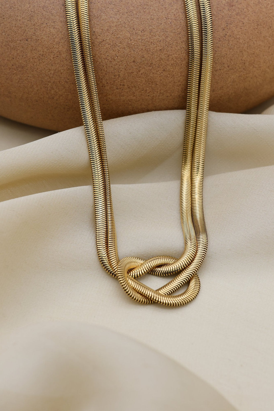 Gold Knot Necklace by FSL&CO, sculpted gold knot pendant
