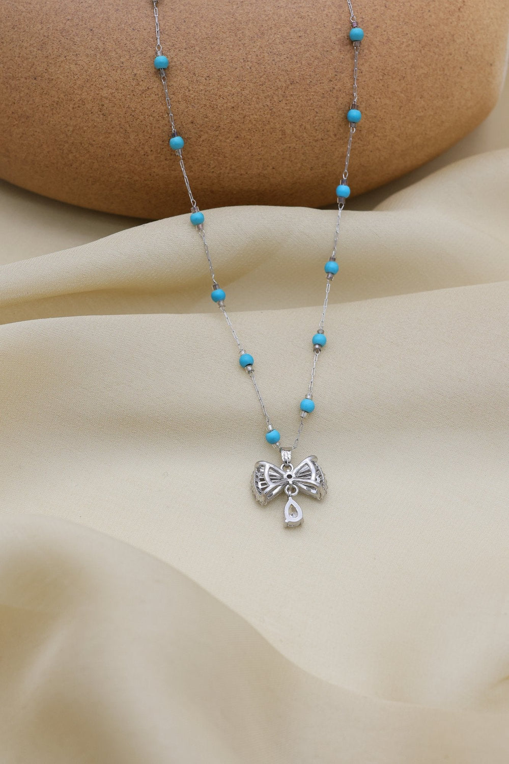 Turquoise Bow Necklace by FSL&CO, alternate view