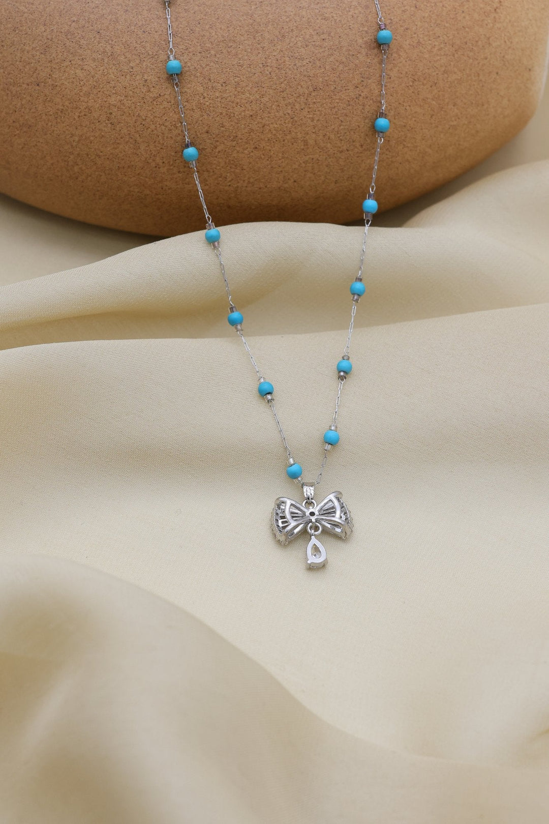 Turquoise Bow Necklace by FSL&CO, alternate view