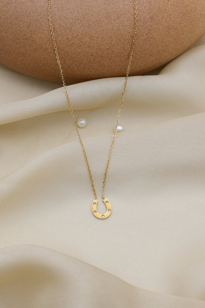 Lucky Horseshoe Necklace by FSL&CO, close-up of the horseshoe pendant