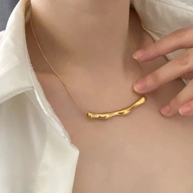 Sculpted Gold Bar Necklace by FSL&CO, curved sculptural gold bar pendant